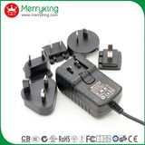 18V1.5A AC/ DC Power Adaptor with Exchangeable Us Au UK EU Jp Cn Plugs